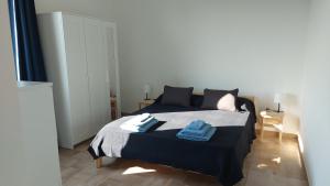 Ένα ή περισσότερα κρεβάτια σε δωμάτιο στο Margot Perfect House