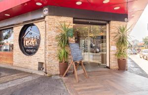 a restaurant with a sign in front of it at Suite Privativa ao lado do Aeroporto de Congonhas212 in São Paulo