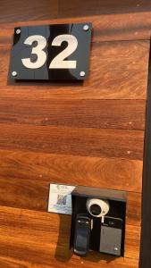 a wooden drawer with a money box with two cameras at Suite Privativa ao lado do Aeroporto de Congonhas212 in Sao Paulo