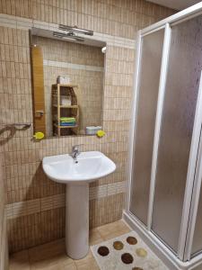 a bathroom with a sink and a shower at Vistas al mar in Carboneras +13 photos