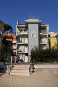 a building with a sign on the side of it at Isola di Pasqua in Caorle