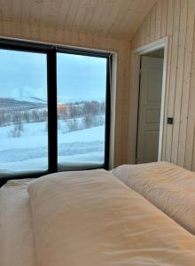 Postel nebo postele na pokoji v ubytování Country Cabin with a view 15 min from Akureyri