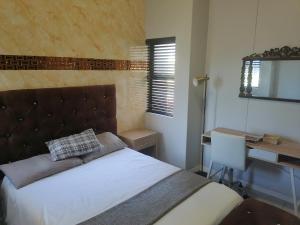 Ένα ή περισσότερα κρεβάτια σε δωμάτιο στο Majestic Umhlanga Suite