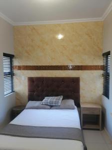 Postel nebo postele na pokoji v ubytování Majestic Umhlanga Suite