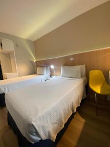 Cama ou camas em um quarto em Hotel WZ Jardins