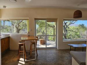 a kitchen with a table and a view of a door at MONTE ZION in Coneta +11 photos