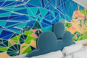 a mural on a wall in a room at Albergo Dipinto BaccoFurore in Furore