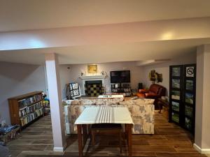 a living room with a couch and a table at Fenton Oasis in Fenton