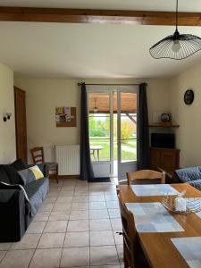 a living room with a couch and a table at Les Gîtes du Bulhion in Molles