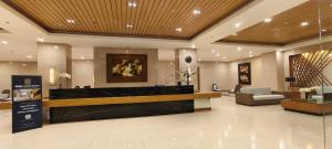 un hall d'entrée avec une réception dans un hôtel dans l'établissement The Cozy Rosy - SMDC Winds Staycation, à Tagaytay