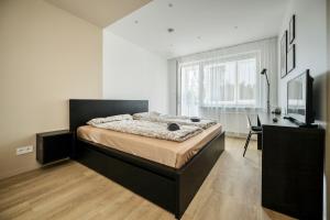 Postel nebo postele na pokoji v ubytování GoldenHugo rooms