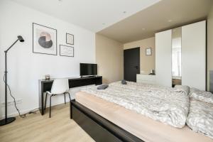 Postel nebo postele na pokoji v ubytování GoldenHugo rooms