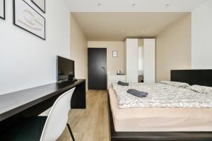 Postel nebo postele na pokoji v ubytování GoldenHugo rooms