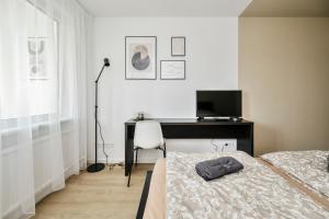 Postel nebo postele na pokoji v ubytování GoldenHugo rooms