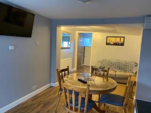 a living room with a table and a couch at The Shak in Banham