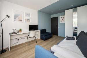 TV a/nebo společenská místnost v ubytování GoldenHugo rooms