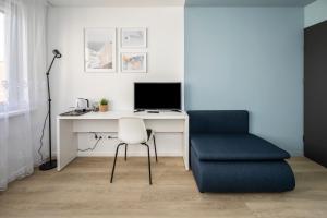 TV a/nebo společenská místnost v ubytování GoldenHugo rooms