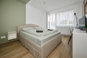 Postel nebo postele na pokoji v ubytování GoldenHugo rooms