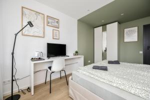 Postel nebo postele na pokoji v ubytování GoldenHugo rooms