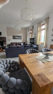 a living room with a couch and a table at Rheinsteig-Ferienwohnungen in Kaub