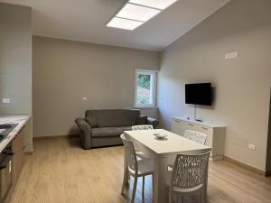 a living room with a table and a couch at Moon Valley Holiday Home in Lauria Inferiore