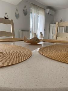a room with two large brown rugs on the floor at Don Michele Apartments in Gizzeria