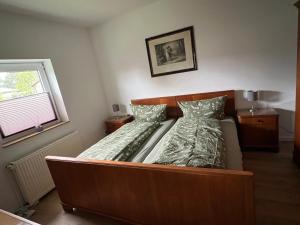 Postel nebo postele na pokoji v ubytování Ferienhaus unterm Kohnstein