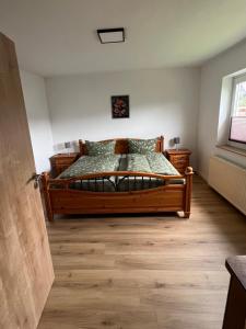 Postel nebo postele na pokoji v ubytování Ferienhaus unterm Kohnstein