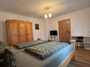 Postel nebo postele na pokoji v ubytování Ferienhaus unterm Kohnstein