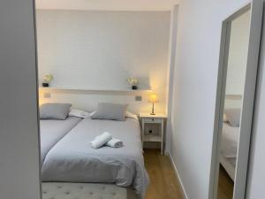 A bed or beds in a room at Mar y Playa de Martín, 2B