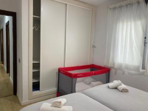 A bed or beds in a room at Mar y Playa de Martín, 2B