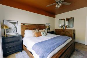 a bedroom with a large bed and a ceiling fan at Breathtaking Lake Views-Dog Friendly-$400 of Free Tickets-High End Decor in Branson +64 photos