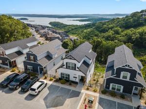 an aerial view of a house with cars parked in a parking lot at Breathtaking Lake Views-Dog Friendly-$400 of Free Tickets-High End Decor in Branson