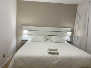 A bed or beds in a room at Mar y Playa de Martín, 2B