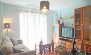 Televízia a/alebo spoločenská miestnosť v ubytovaní Cozy apartment + parking Playa San Juan