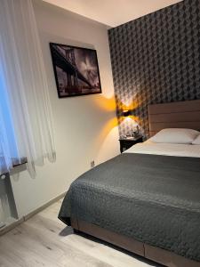 Posteľ alebo postele v izbe v ubytovaní Apartments Gradowa