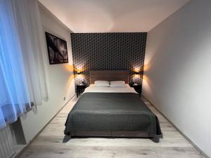 Posteľ alebo postele v izbe v ubytovaní Apartments Gradowa