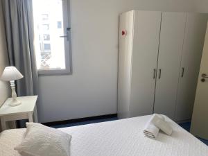 A bed or beds in a room at Mar y Playa de Martín, 2B