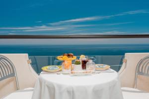 a table with a plate of food on top at Albergo Dipinto BaccoFurore in Furore