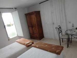 Postel nebo postele na pokoji v ubytování Habitaciones Los Semellones