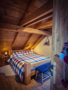 a bedroom with a bed in a wooden attic at Casa Kapusta, Hidden gem in nature, Swimming poll, Jacuzzi, Fire Pit in Ogulin +73 photos