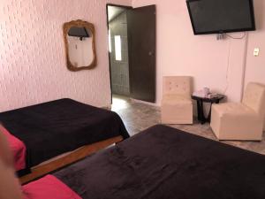 Ένα ή περισσότερα κρεβάτια σε δωμάτιο στο Grill town relax house