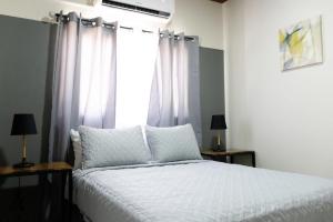 Postel nebo postele na pokoji v ubytování Hotel Boutique Bueso