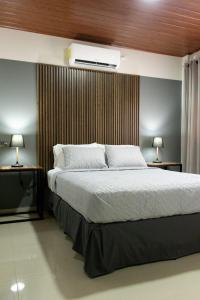 Postel nebo postele na pokoji v ubytování Hotel Boutique Bueso