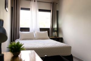 Postel nebo postele na pokoji v ubytování Hotel Boutique Bueso