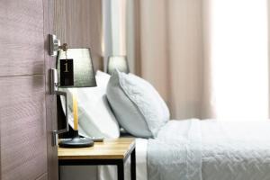 Postel nebo postele na pokoji v ubytování Hotel Boutique Bueso