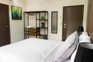 Postel nebo postele na pokoji v ubytování Hotel Boutique Bueso