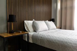 Postel nebo postele na pokoji v ubytování Hotel Boutique Bueso