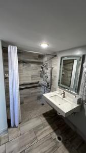 a bathroom with a sink and a shower at La Quinta Inn by Wyndham Amarillo Mid-City in Amarillo