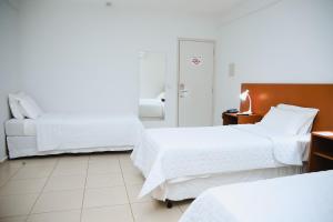 Katil atau katil-katil dalam bilik di Hotel Água Das Araras +37 gambar